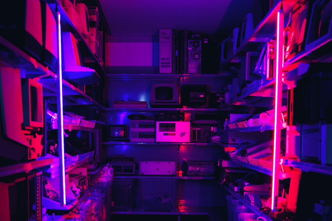 a-room-filled-with-lots-of-purple-and-red-lights-gh2smlahcr8